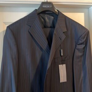 3 button suit. Brand new. Never altered